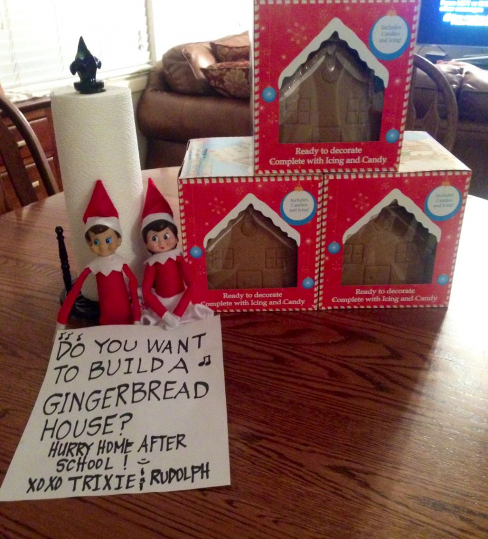 Elf on the Shelf decorating gingerbread house